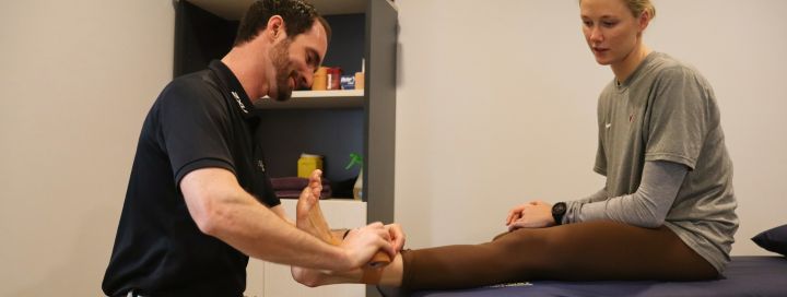 Coast Sport client getting foot taped