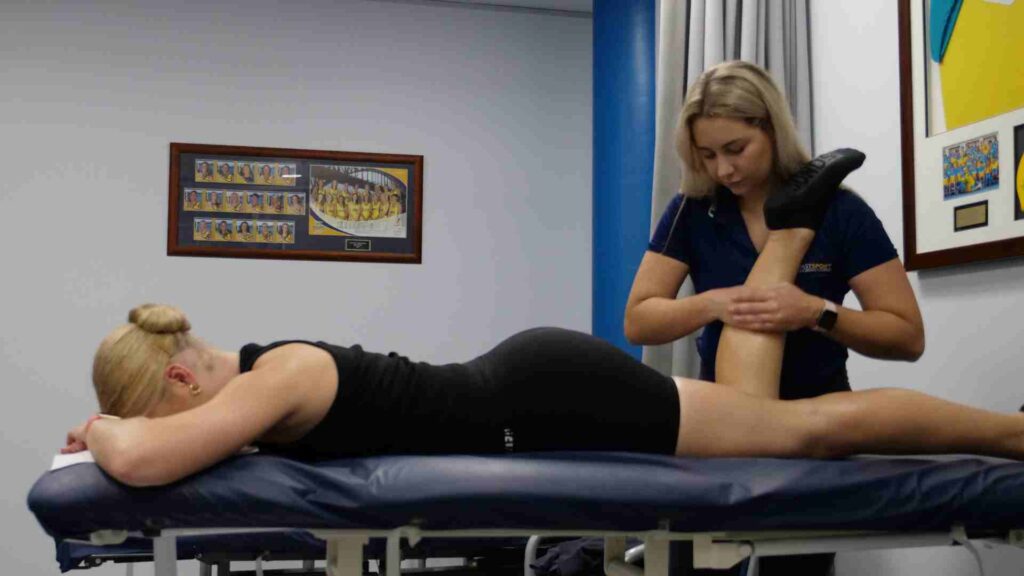Woman performing leg physiotherapy