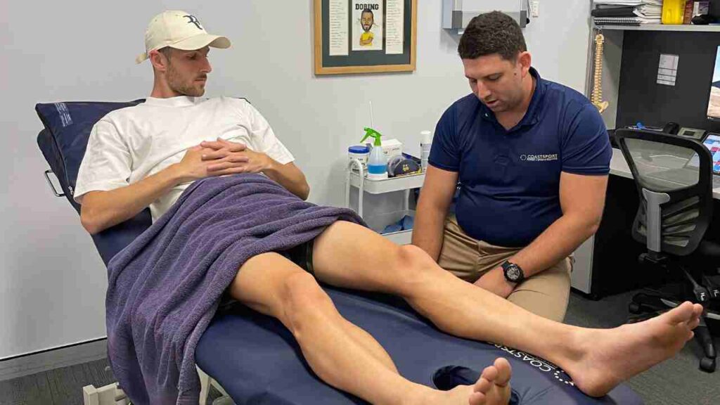 Professional performing leg therapy consultation
