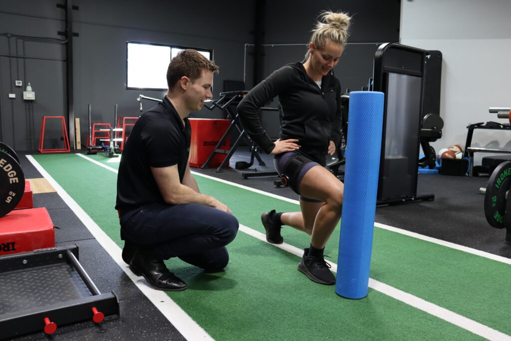 woman doing exercises with physio accompanying